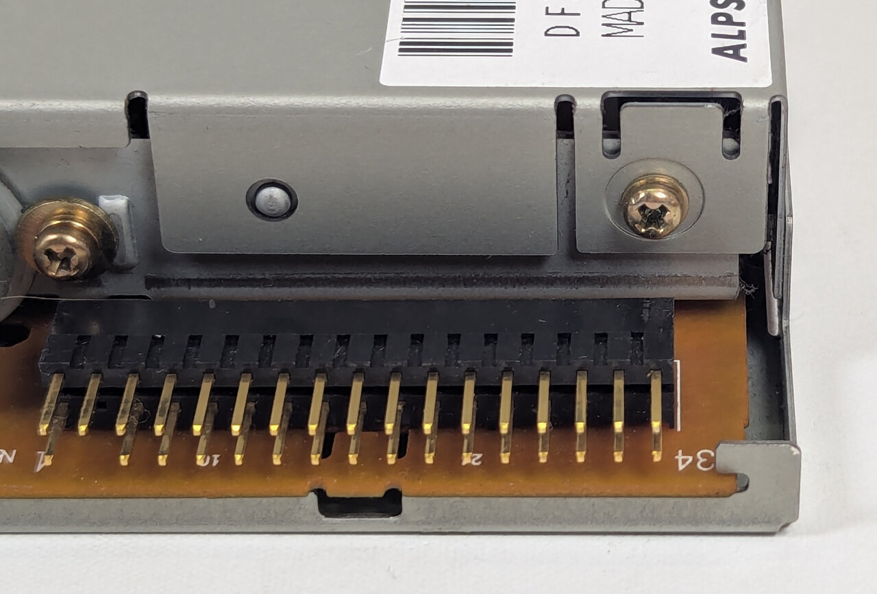 Screw and pins on the back of the drive