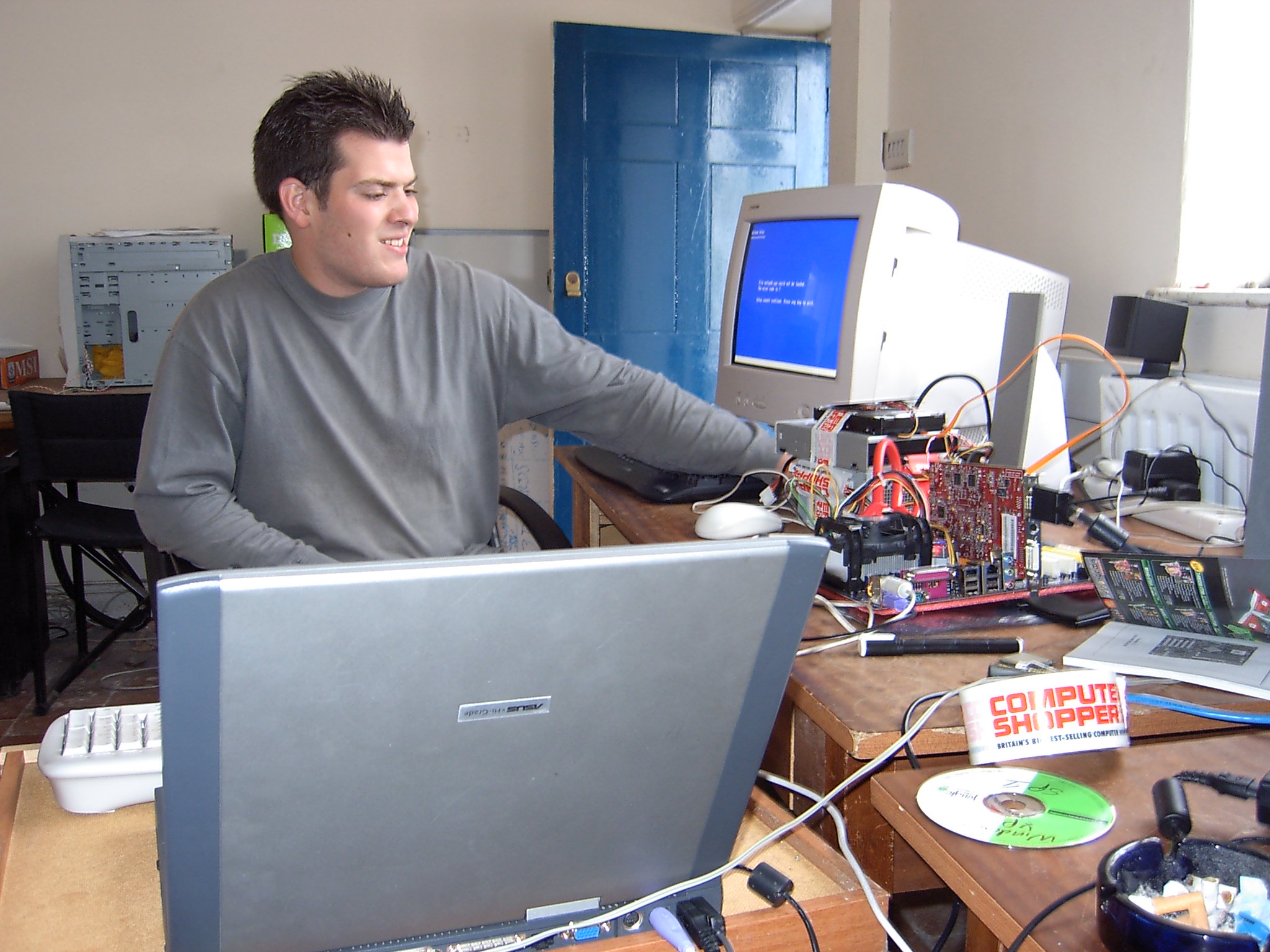 An old picture of me testing graphics cards around 2004 for Computer Shopper.